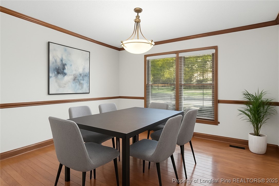 484 Lands End Road Fayetteville, NC 28314 - Photo 9 of 41 a view of a dining room with furniture window and wooden floor