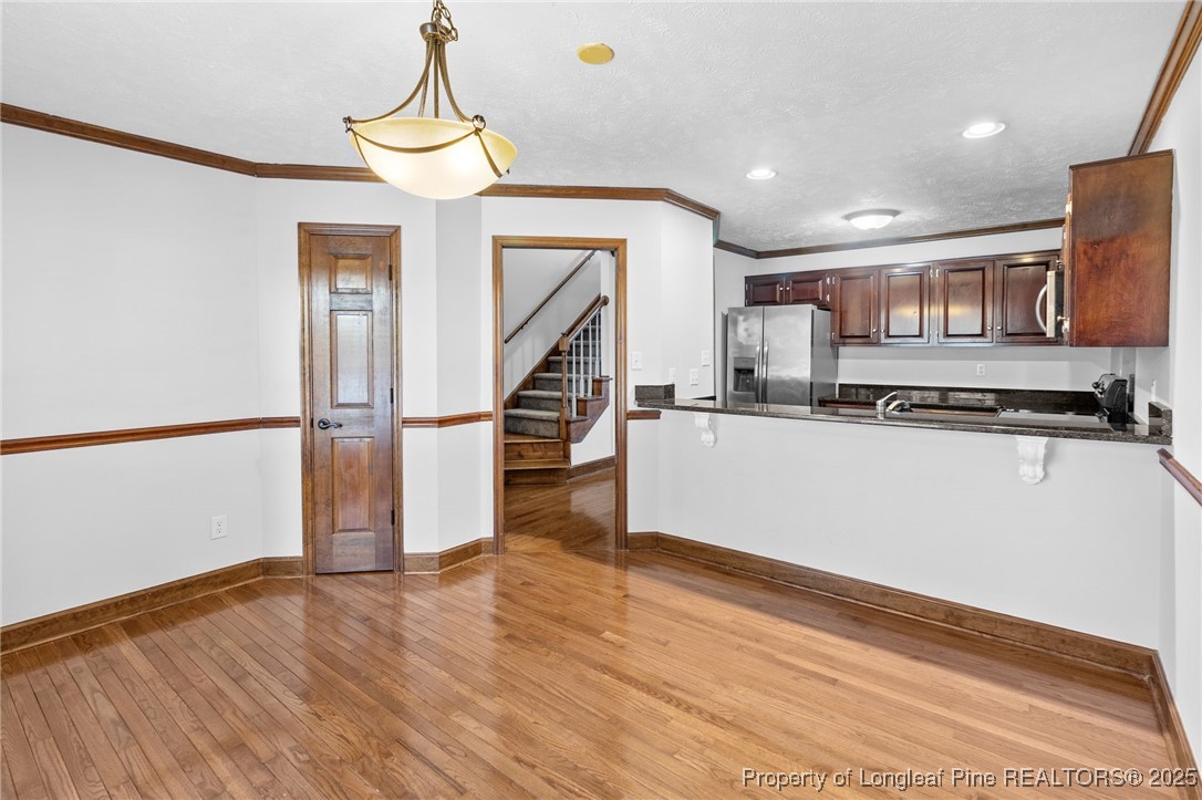 484 Lands End Road Fayetteville, NC 28314 - Photo 10 of 41 a view of kitchen with stainless steel appliances granite countertop a stove and a wooden floor