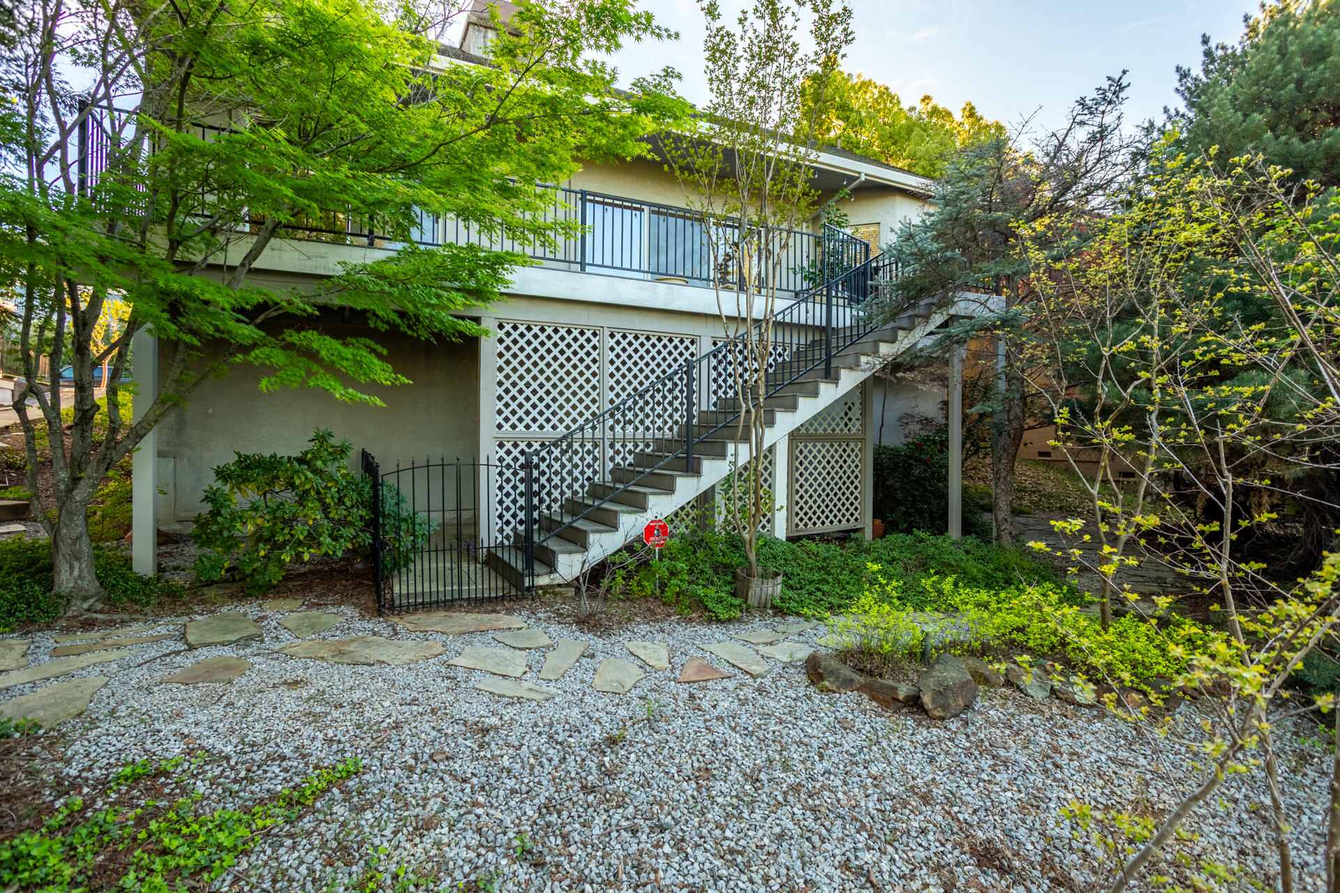 3126 Riesling Path Redding, CA 96001 - Photo 25 of 32 a view of a house with a street and plants