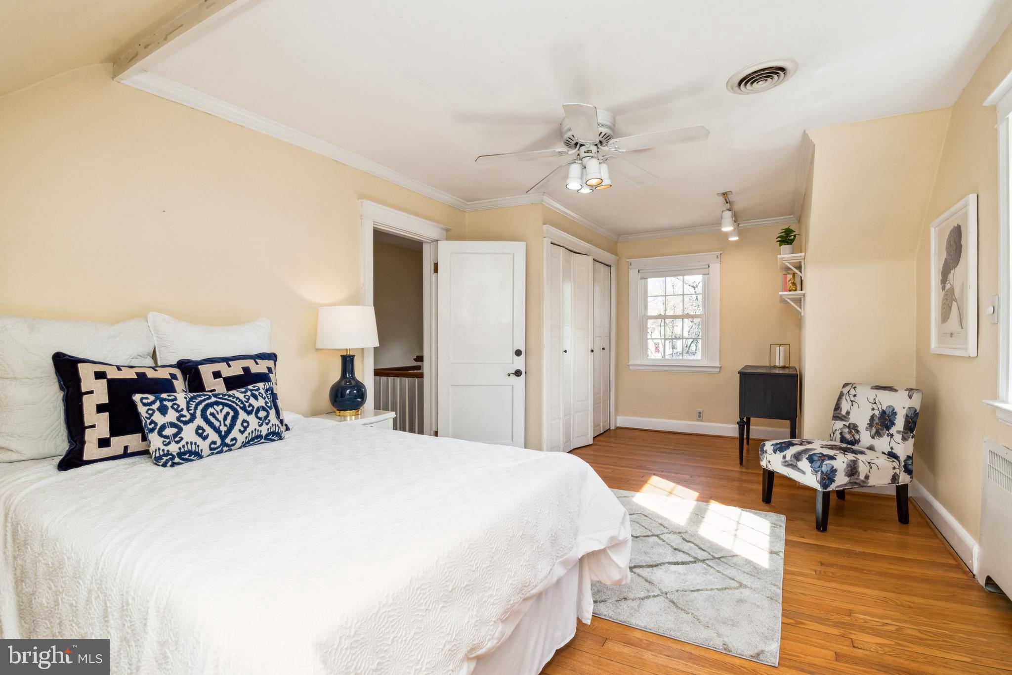 716 Anneslie Road Baltimore, MD 21212 - Photo 23 of 27 a bedroom with a bed and wooden floor