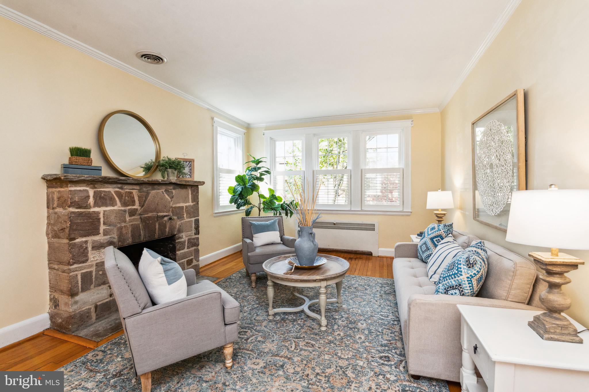 716 Anneslie Road Baltimore, MD 21212 - Photo 4 of 27 a living room with furniture a window and a fireplace