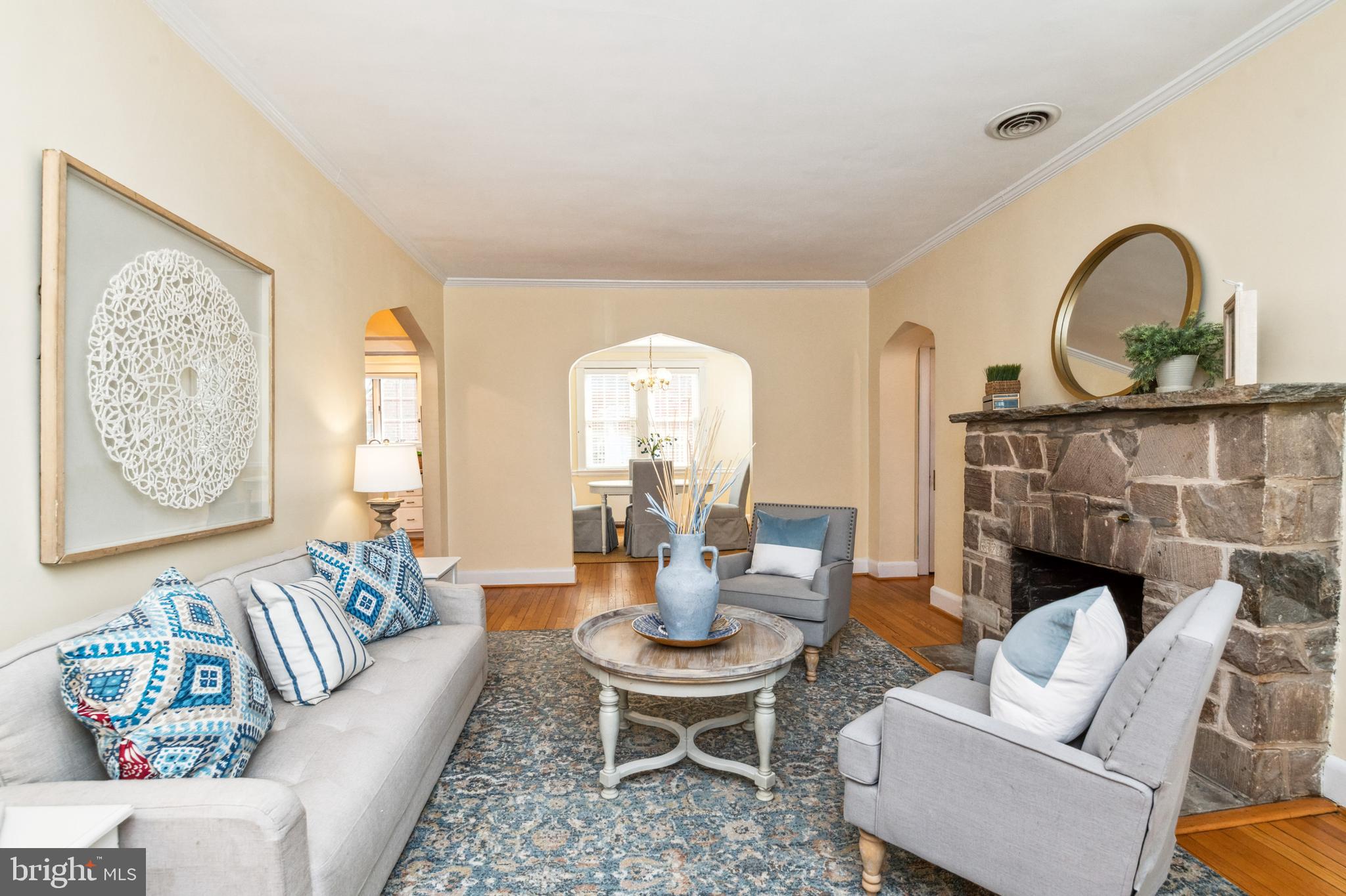 716 Anneslie Road Baltimore, MD 21212 - Photo 5 of 27 a living room with furniture a fireplace and a table