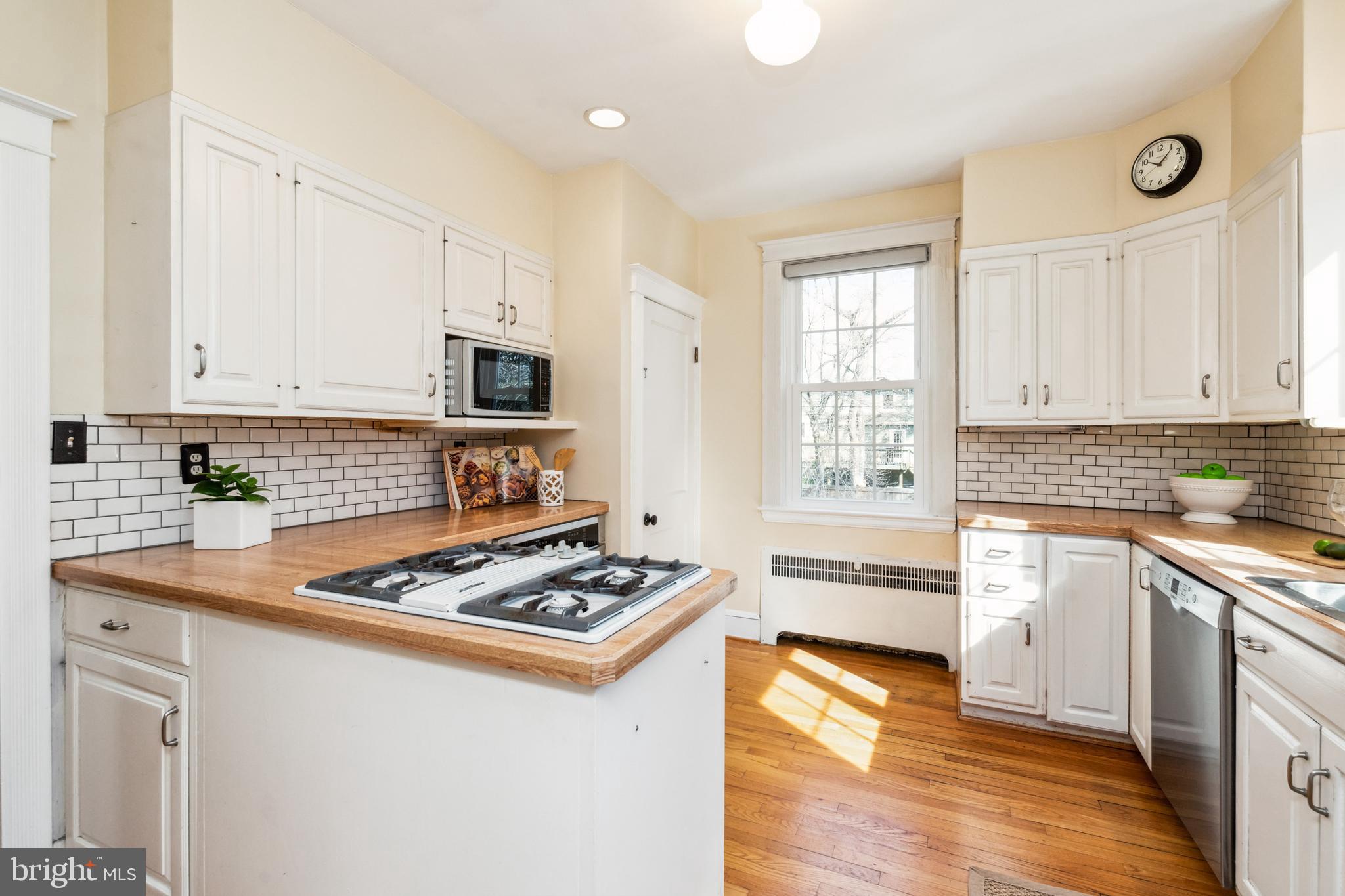 716 Anneslie Road Baltimore, MD 21212 - Photo 9 of 27 a kitchen with granite countertop a stove sink and cabinets