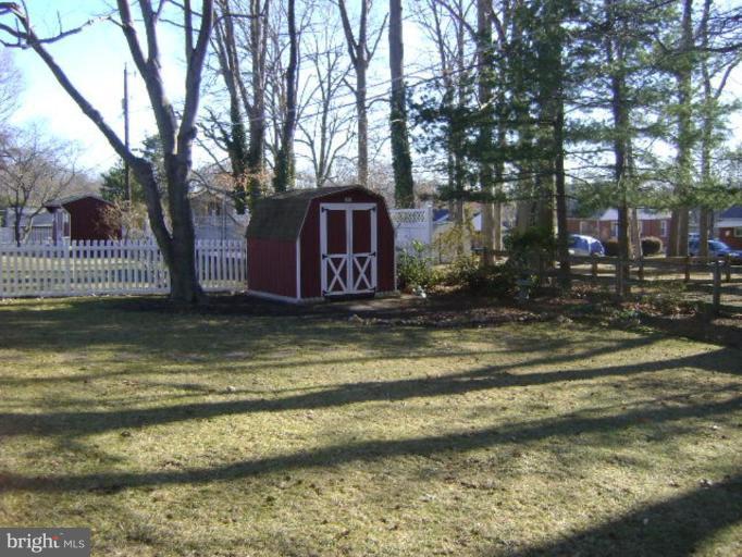 9823 Forge Park Road Perry Hall, MD 21128 - Photo 4 of 14 a view of a yard in front of a house with a fountain