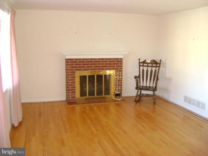 9823 Forge Park Road Perry Hall, MD 21128 - Photo 5 of 14 a view of an empty room with glass door