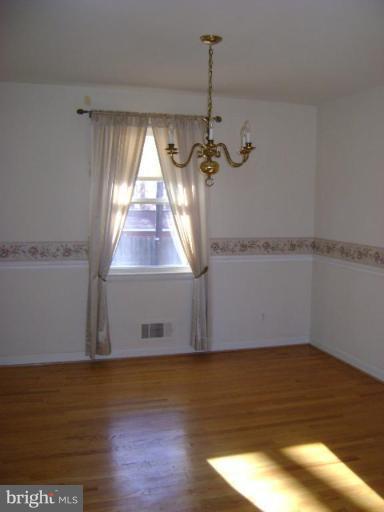 9823 Forge Park Road Perry Hall, MD 21128 - Photo 6 of 14 a view of a room with wooden floor and window