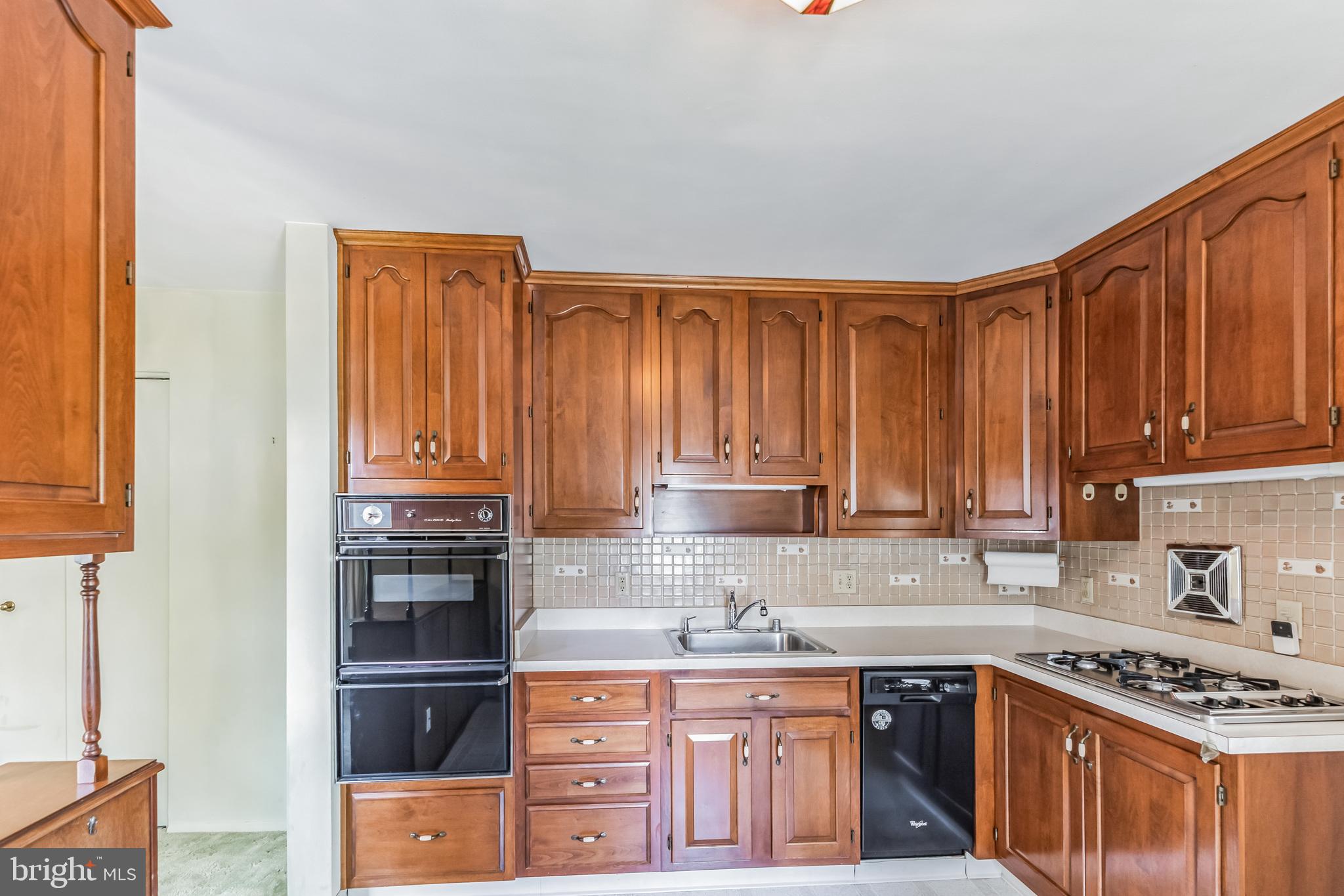 9023 Tammy Road Nottingham, MD 21236 - Photo 5 of 32 Kitchen - tons of cherry wood cabinets!