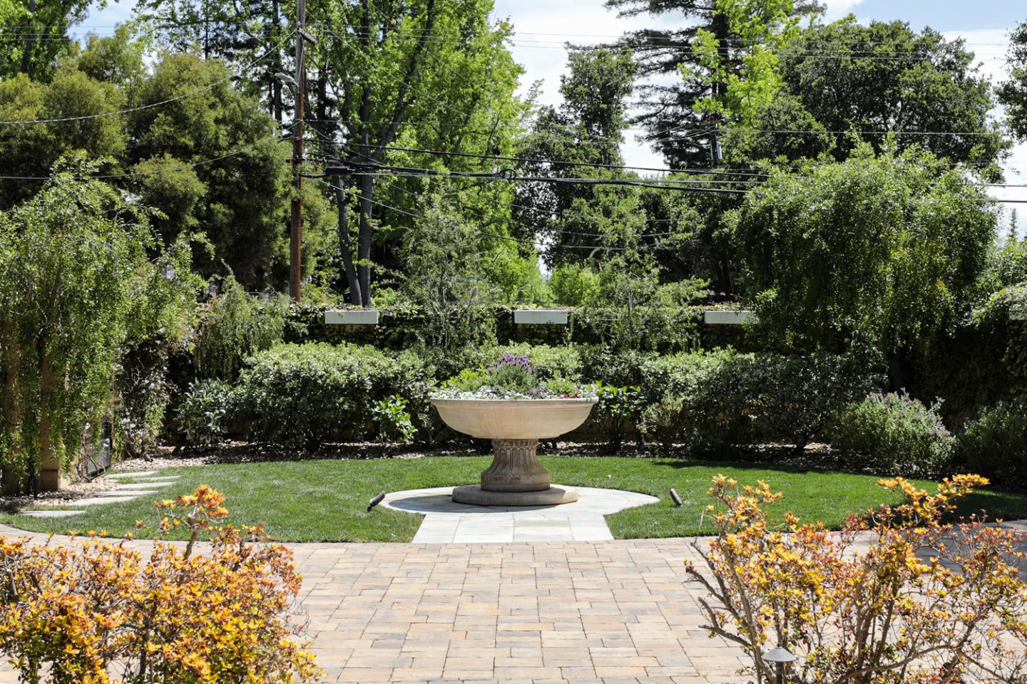 a view of a garden with a fountain