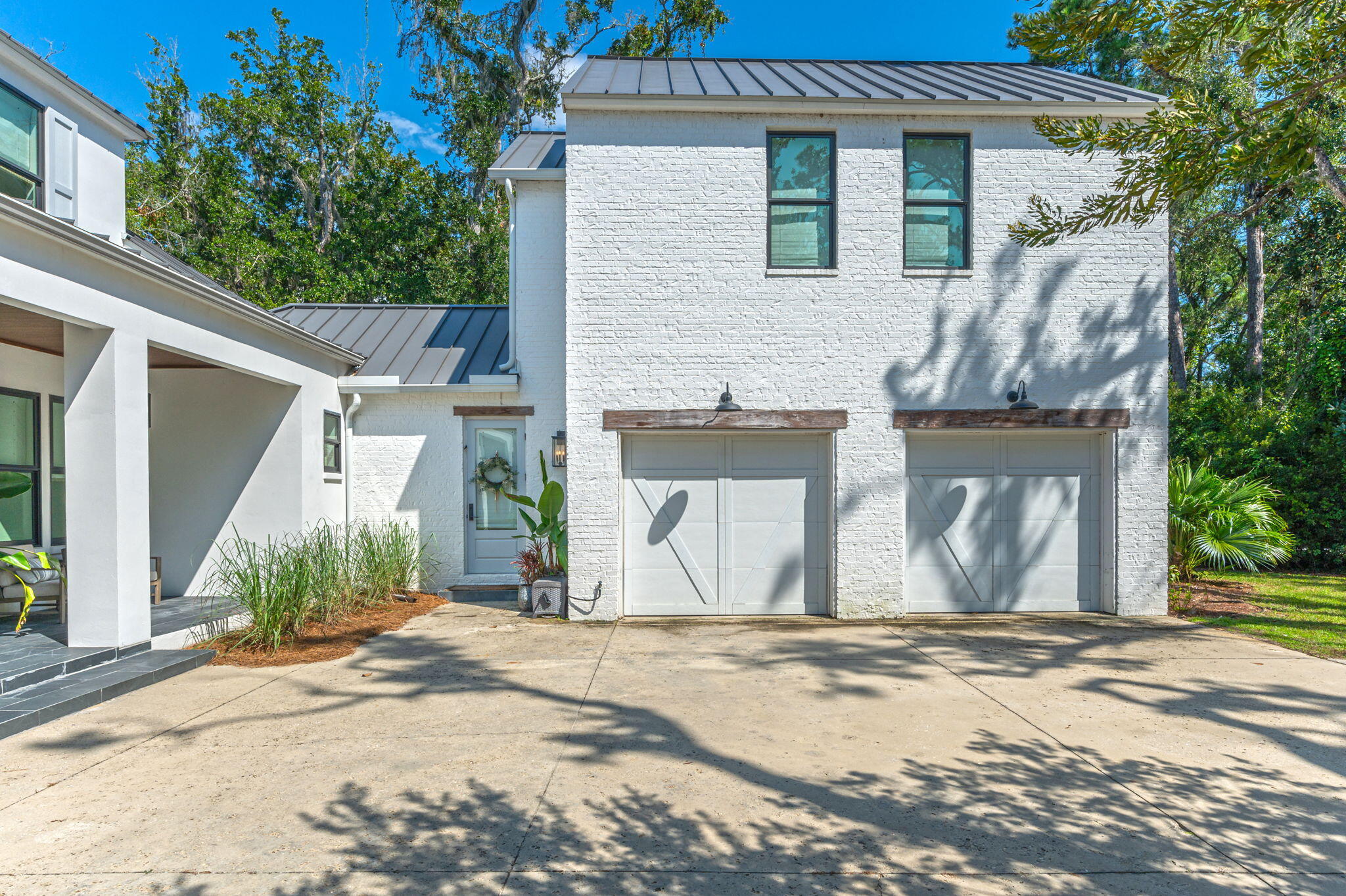 164 Bay Trace Santa Rosa Beach, FL 32459 - Photo 3 of 90 a front view of a house with a yard and garage