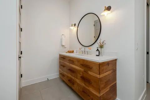 a bathroom with a sink and a mirror