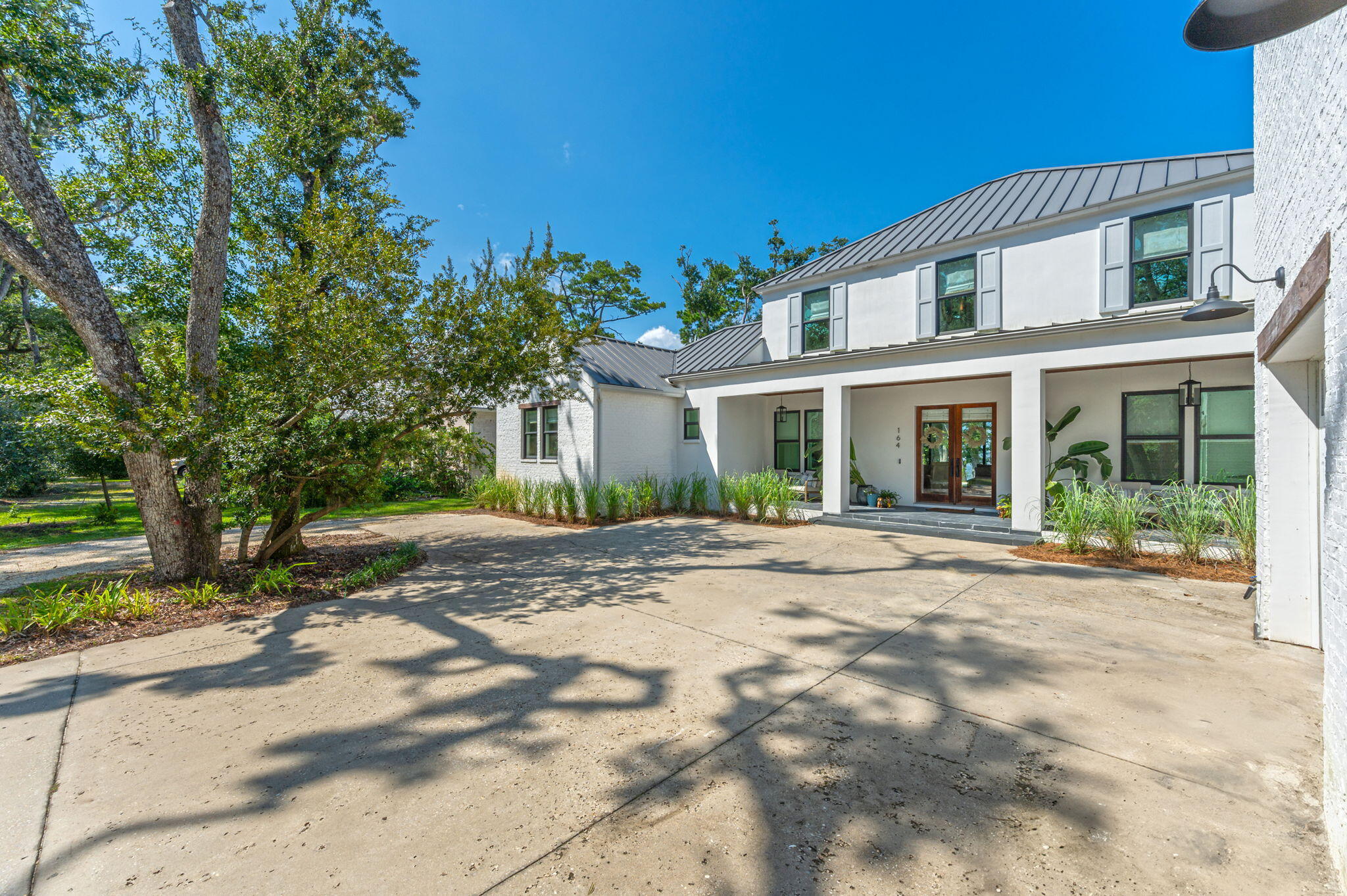 164 Bay Trace Santa Rosa Beach, FL 32459 - Photo 5 of 90 a view of a house with a tree in front of it