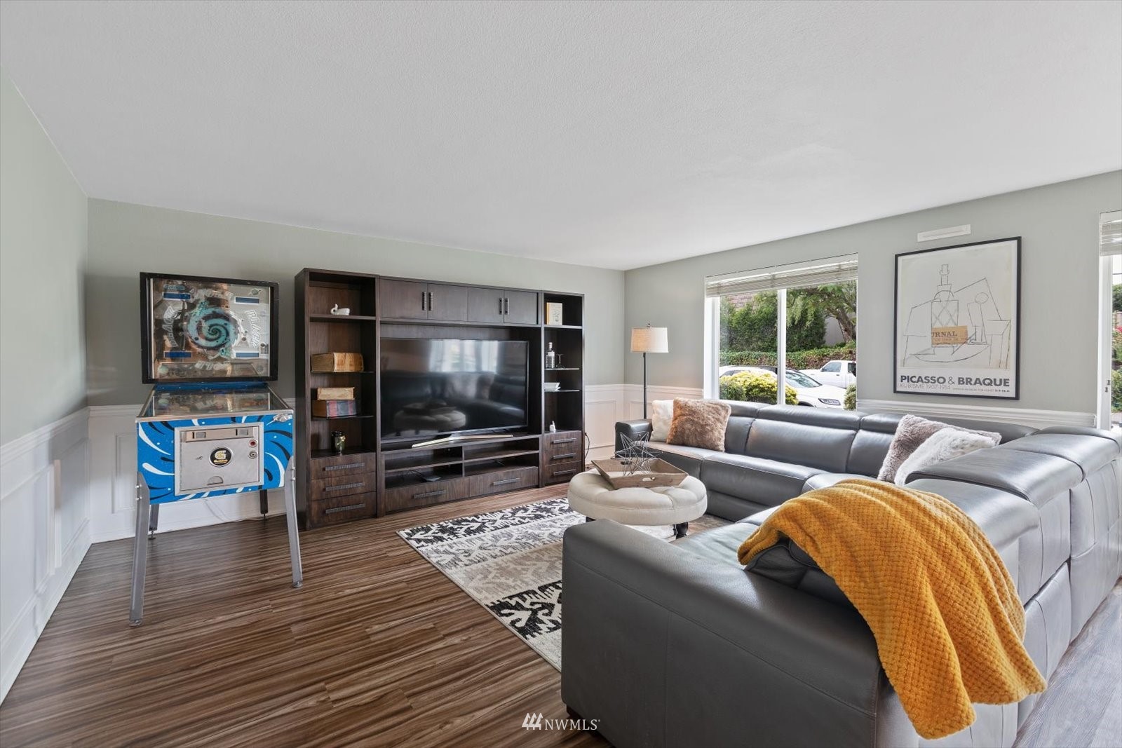 555 Walnut Street, Unit 4 Edmonds, WA 98020 - Photo 5 of 16 a living room with furniture and a flat screen tv