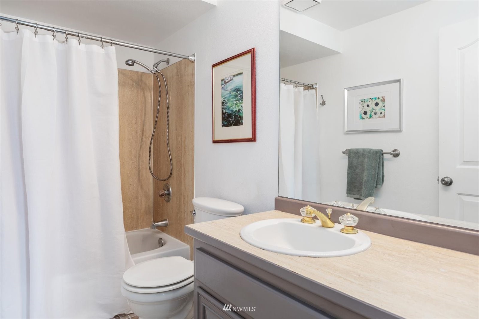555 Walnut Street, Unit 4 Edmonds, WA 98020 - Photo 9 of 16 a bathroom with a sink toilet and shower