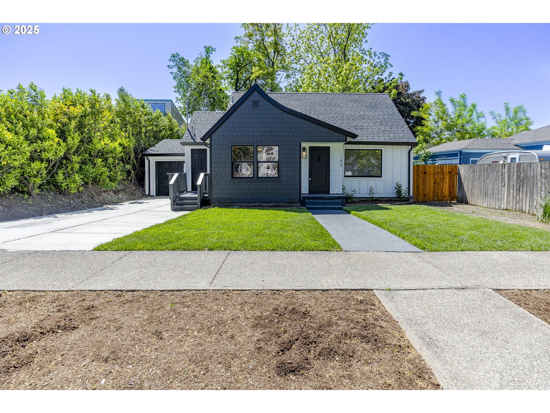 a house with yard in front of it