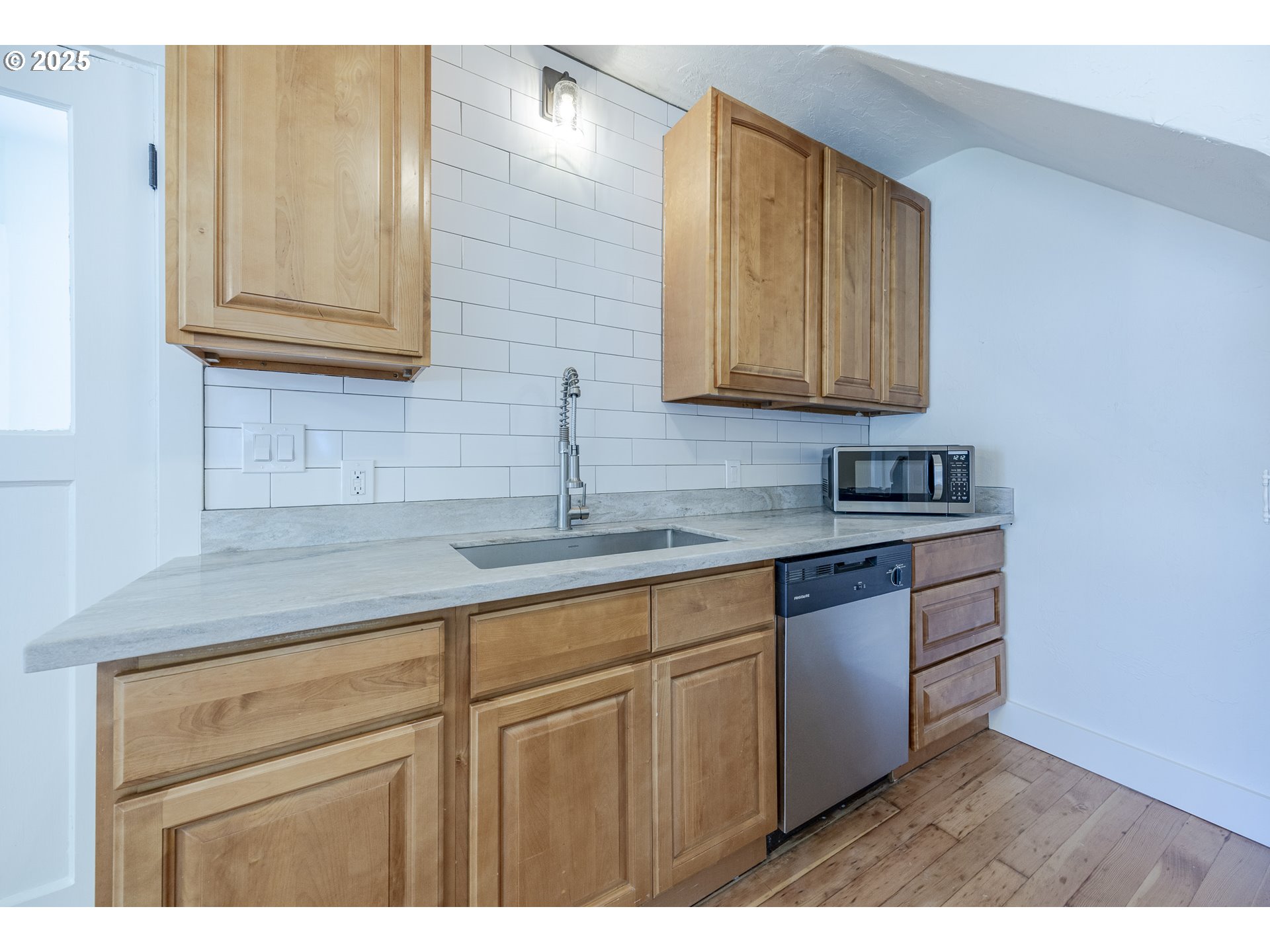 155 B Street Springfield, OR 97477 - Photo 19 of 42 a kitchen with cabinets appliances and a sink