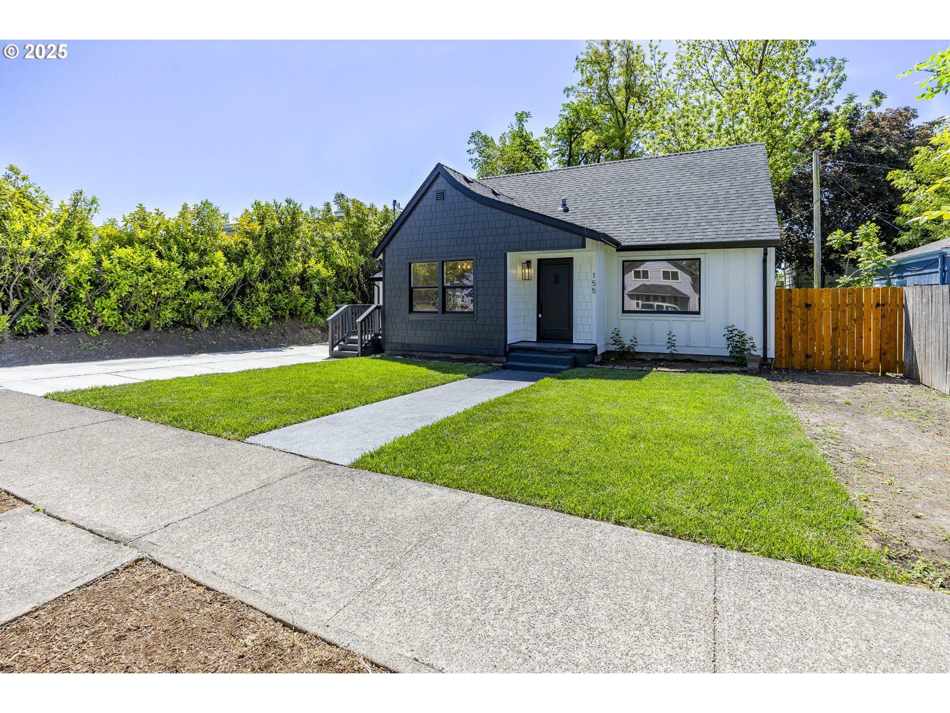 155 B Street Springfield, OR 97477 - Photo 2 of 42 a house with a yard in front of it