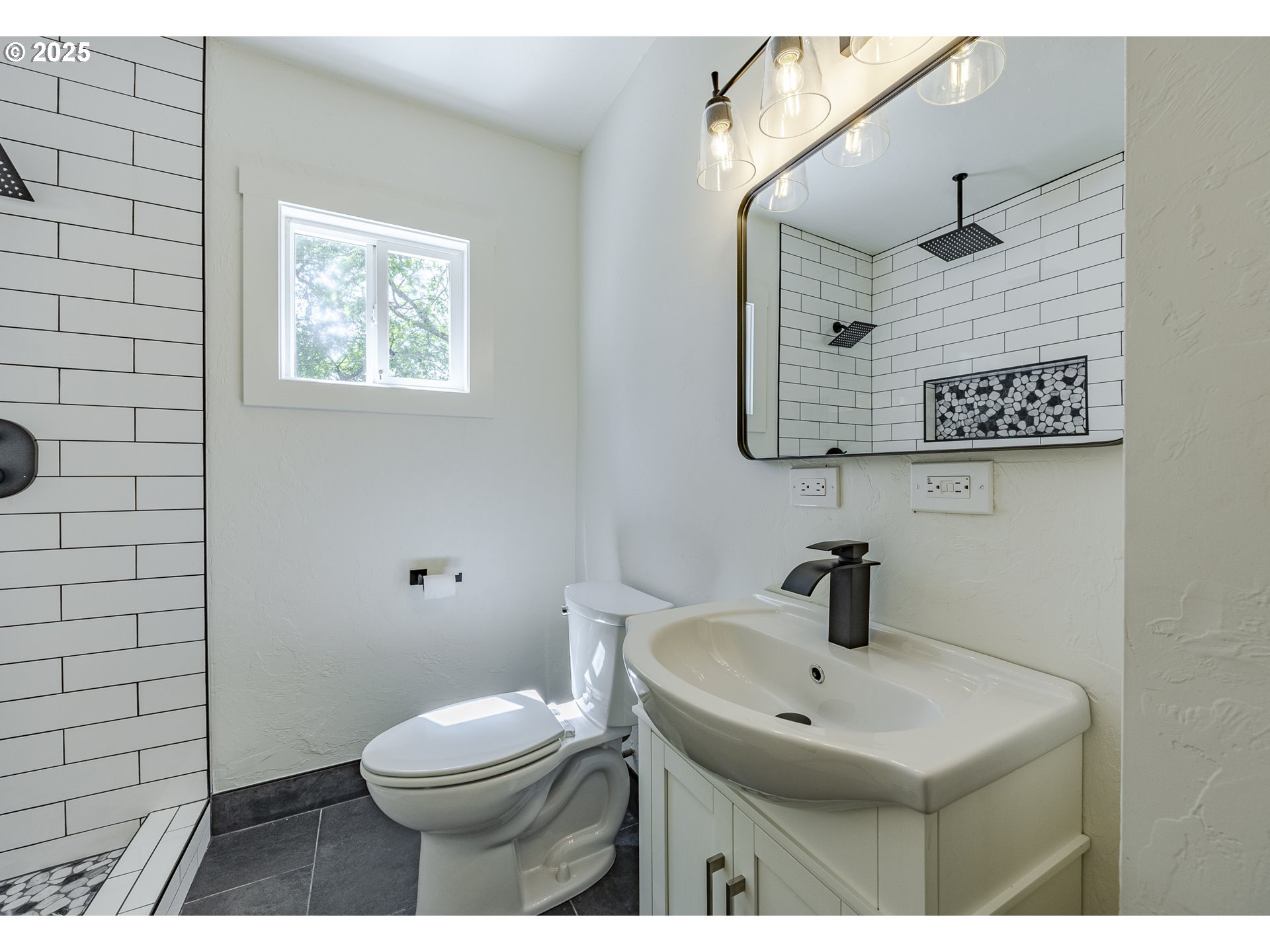 155 B Street Springfield, OR 97477 - Photo 24 of 42 a bathroom with a toilet sink and mirror