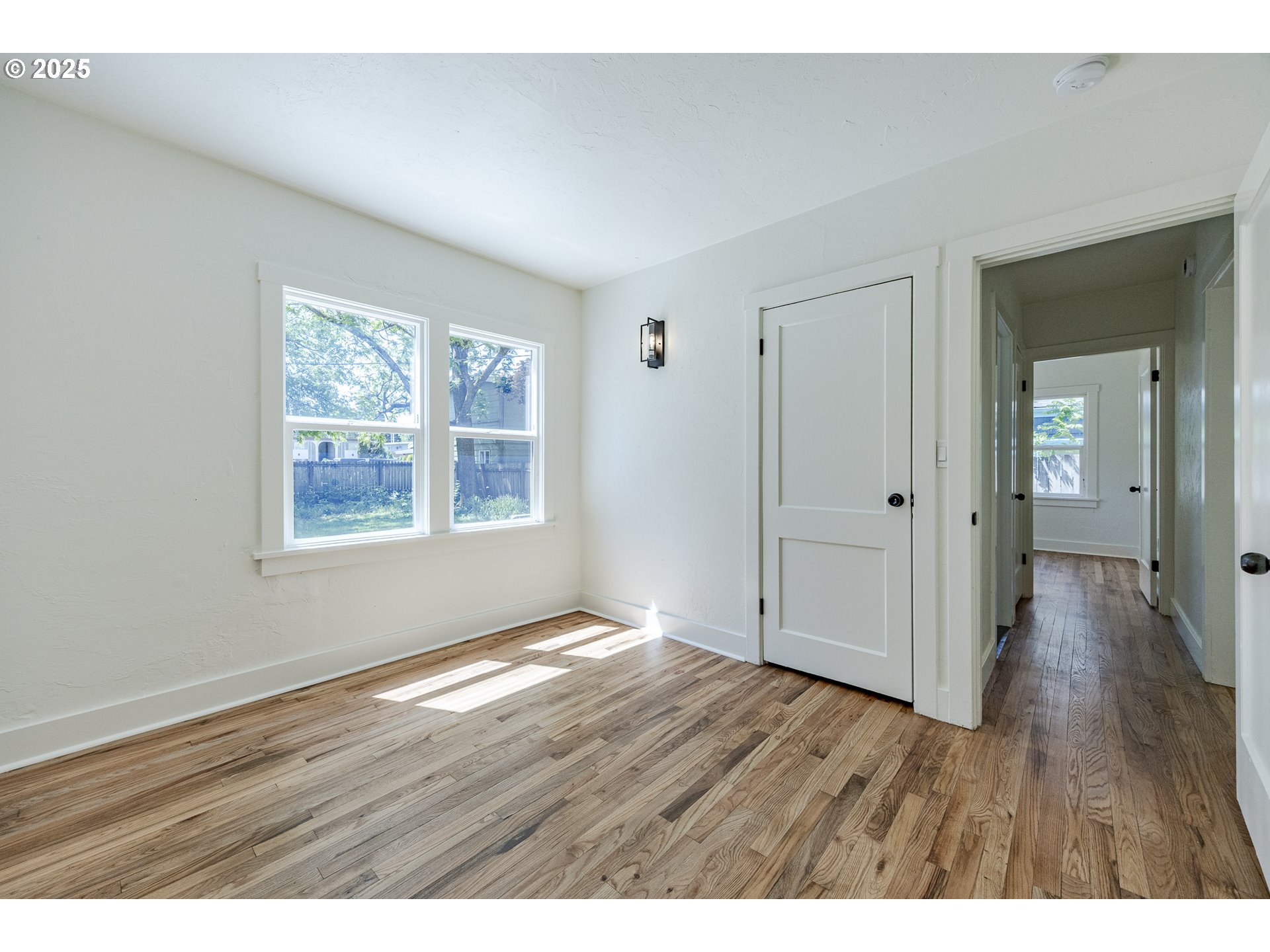 155 B Street Springfield, OR 97477 - Photo 30 of 42 a view of an empty room with wooden floor and a window