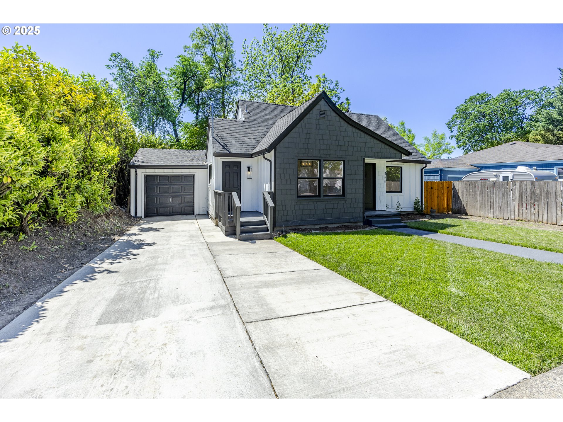 155 B Street Springfield, OR 97477 - Photo 3 of 42 a house view with a garden space