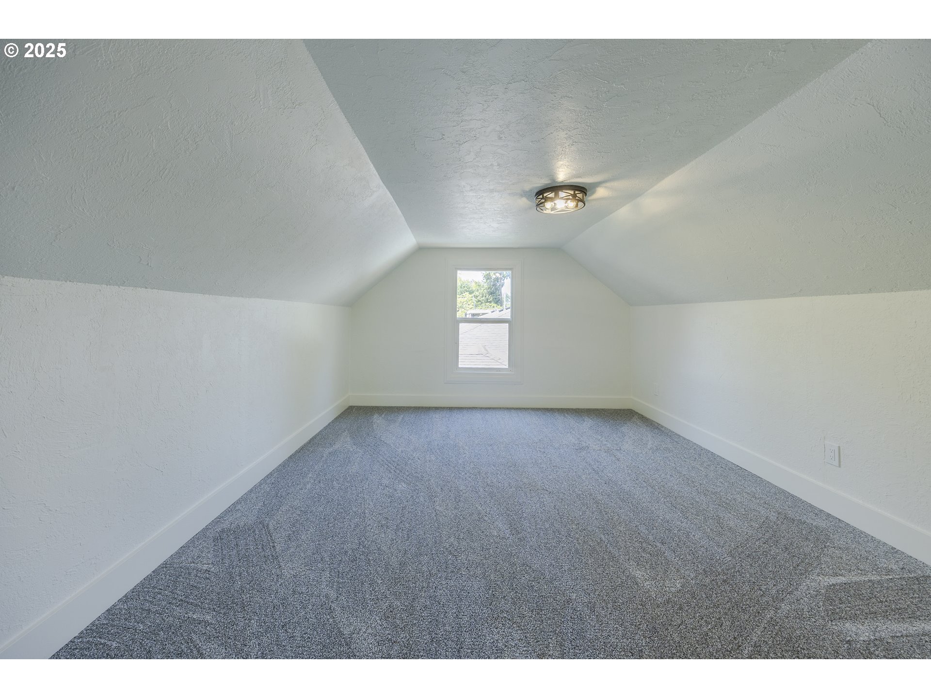 155 B Street Springfield, OR 97477 - Photo 34 of 42 a view of an empty room with a window
