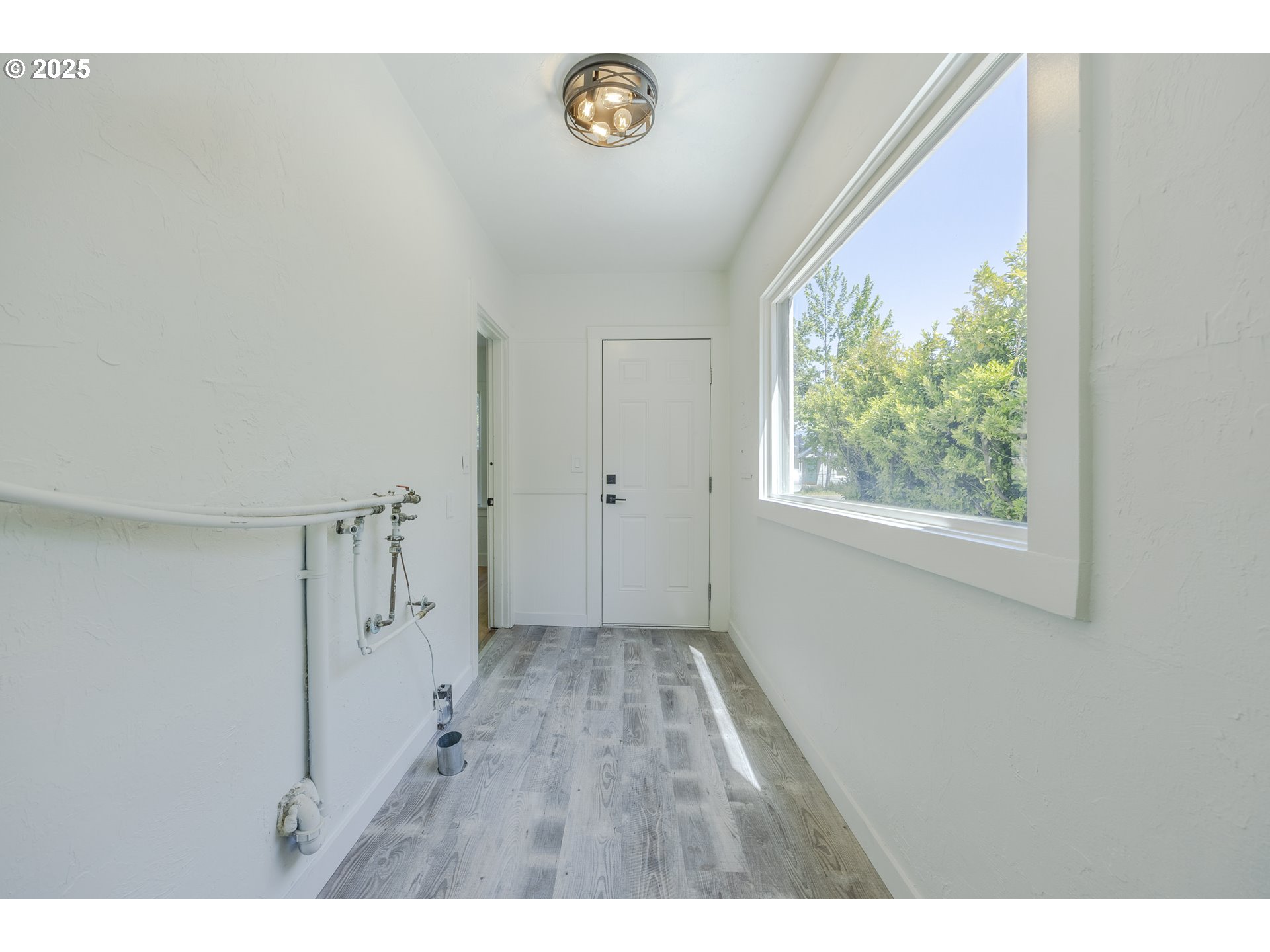 155 B Street Springfield, OR 97477 - Photo 37 of 42 a view of an empty room with a window