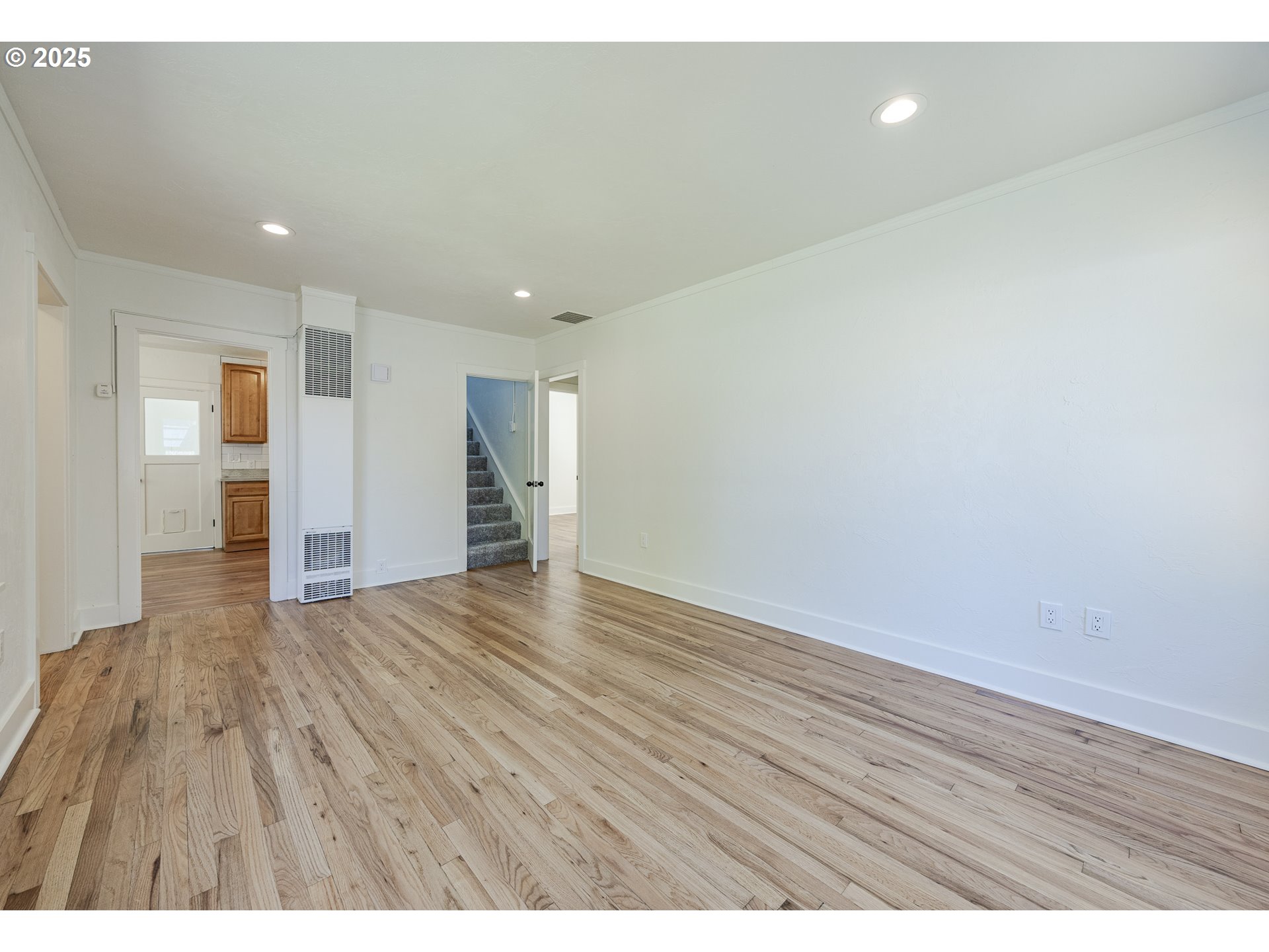 155 B Street Springfield, OR 97477 - Photo 7 of 42 a view of an empty room and wooden floor