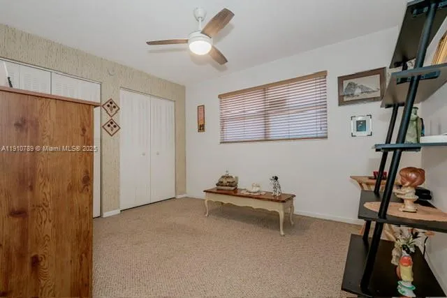 a bedroom with furniture and a window