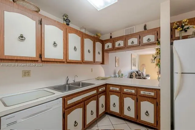 a bathroom with a sink a mirror and a shower