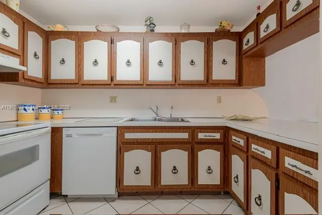 a bathroom with a sink a vanity and a large mirror