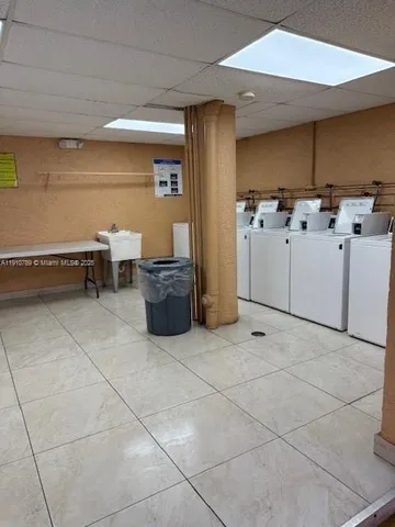 a utility room with cabinets
