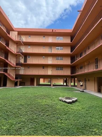 a view of building with yard