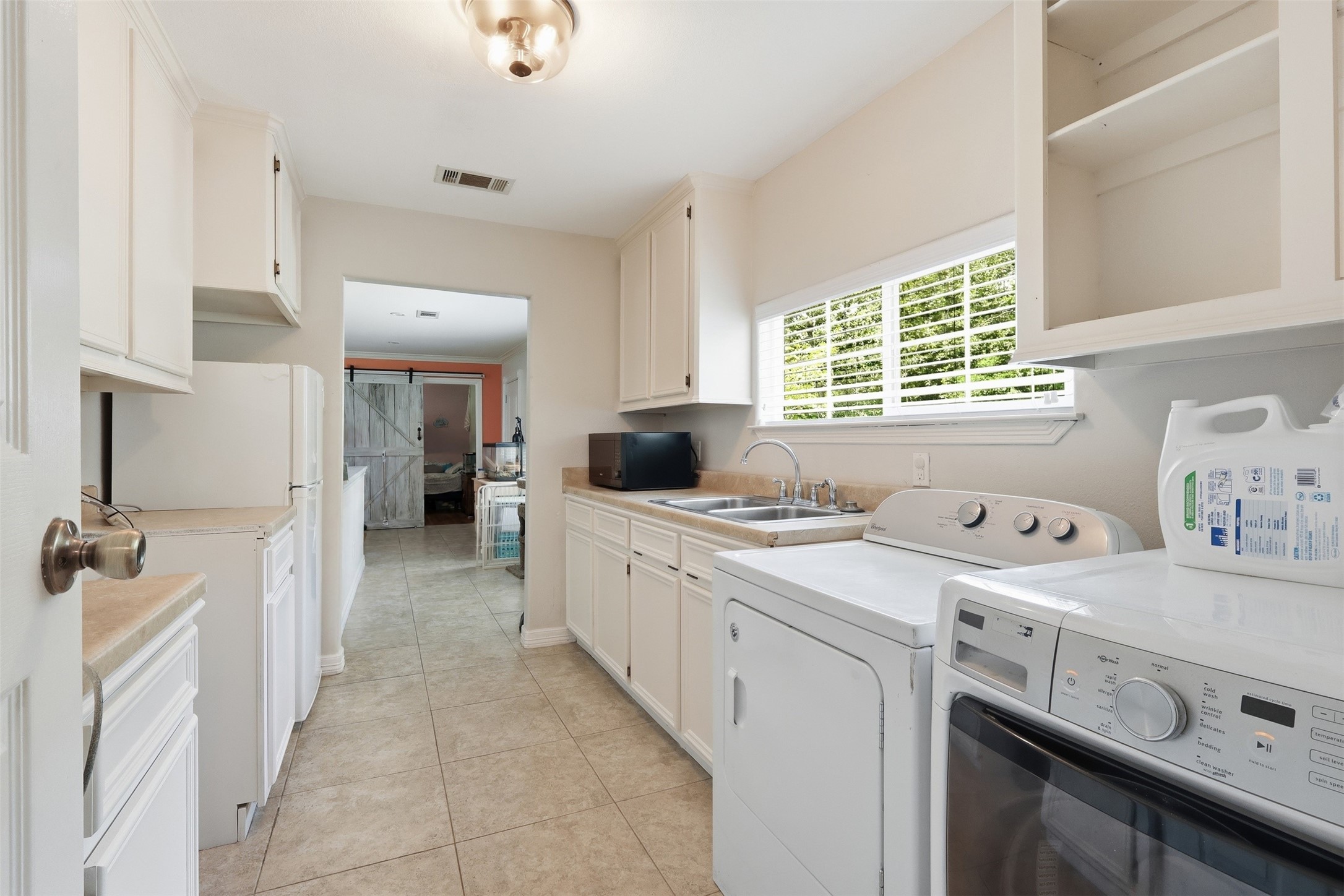 10695 White Rock Road Conroe, TX 77306 - Photo 13 of 48 Laundry room with extra storage & room for a fridge
