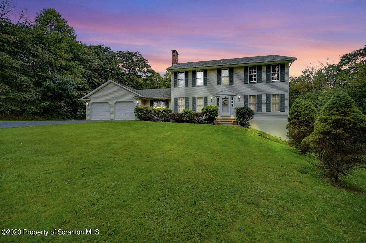 a view of a house with a big yard