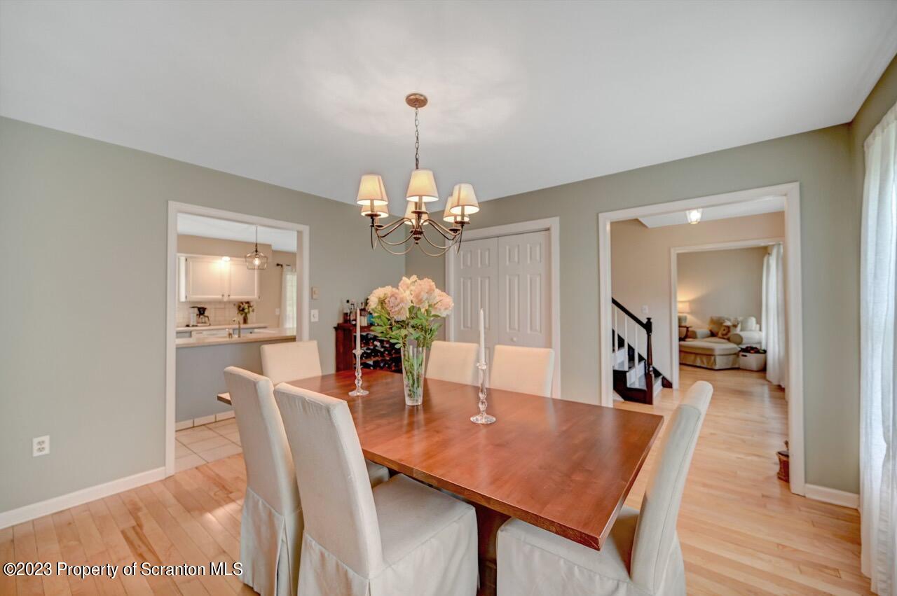 196 Elkview Drive Forest City, PA 18421 - Photo 17 of 67 a dining room with furniture a chandelier and wooden floor