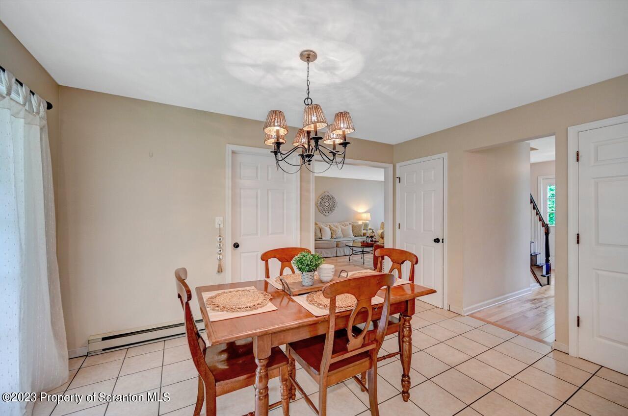 196 Elkview Drive Forest City, PA 18421 - Photo 22 of 67 a view of a dining room with furniture and a chandelier fan