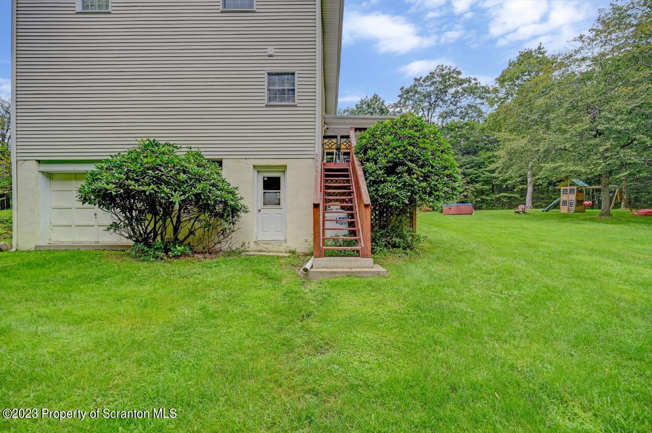 196 Elkview Drive Forest City, PA 18421 - Photo 54 of 67 a view of a backyard with plants and large trees
