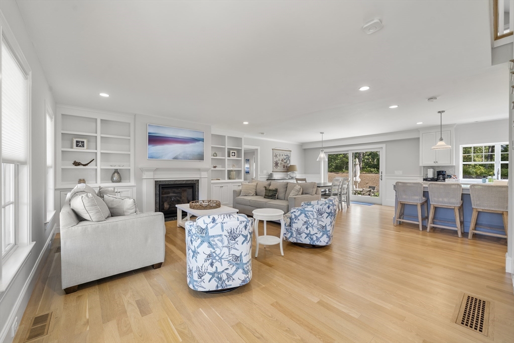 3 Bascom Hollow Harwich, MA 02645 - Photo 11 of 32 a living room with furniture and a fireplace