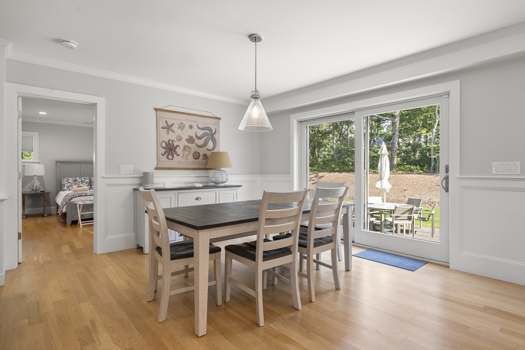 3 Bascom Hollow Harwich, MA 02645 - Photo 12 of 32 a dining room with furniture window wooden floor