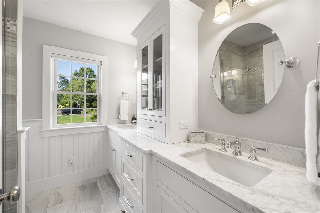 3 Bascom Hollow Harwich, MA 02645 - Photo 17 of 32 a bathroom with a double vanity sink and a mirror