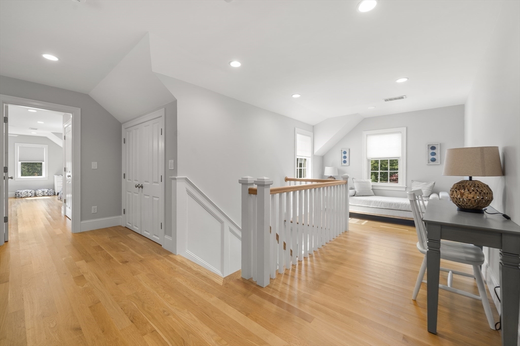 3 Bascom Hollow Harwich, MA 02645 - Photo 19 of 32 a view of a hallway with wooden floor and windows