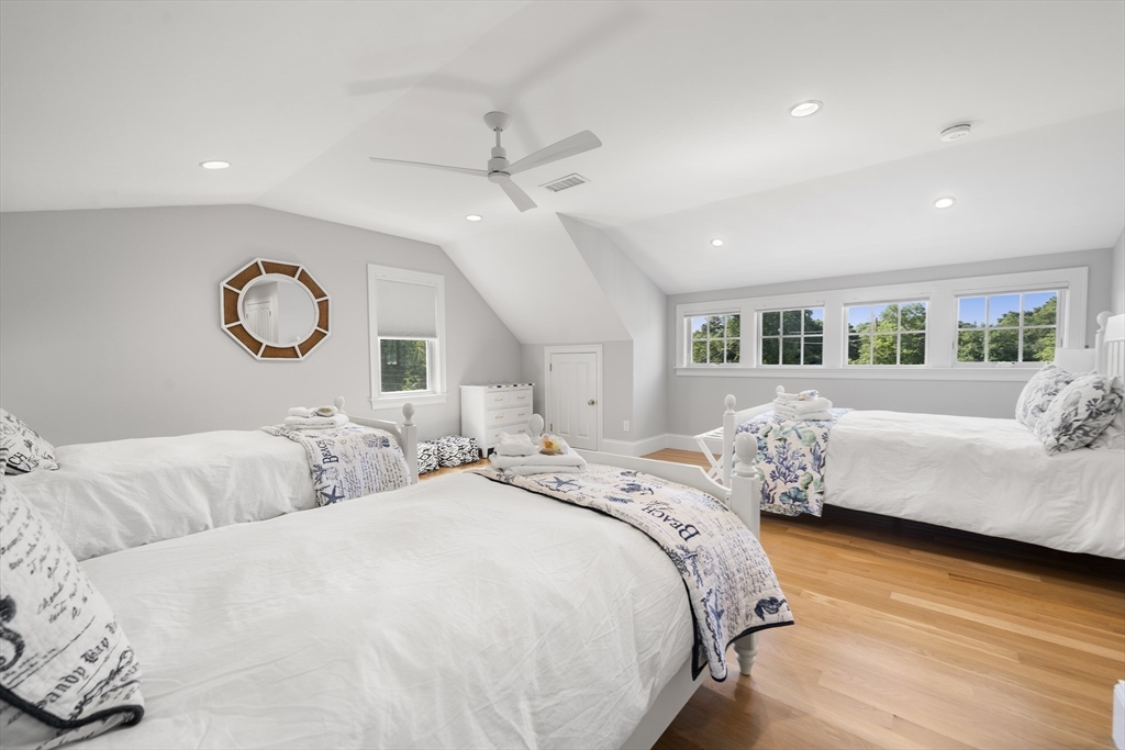 3 Bascom Hollow Harwich, MA 02645 - Photo 28 of 32 a bedroom with bed and a large mirror