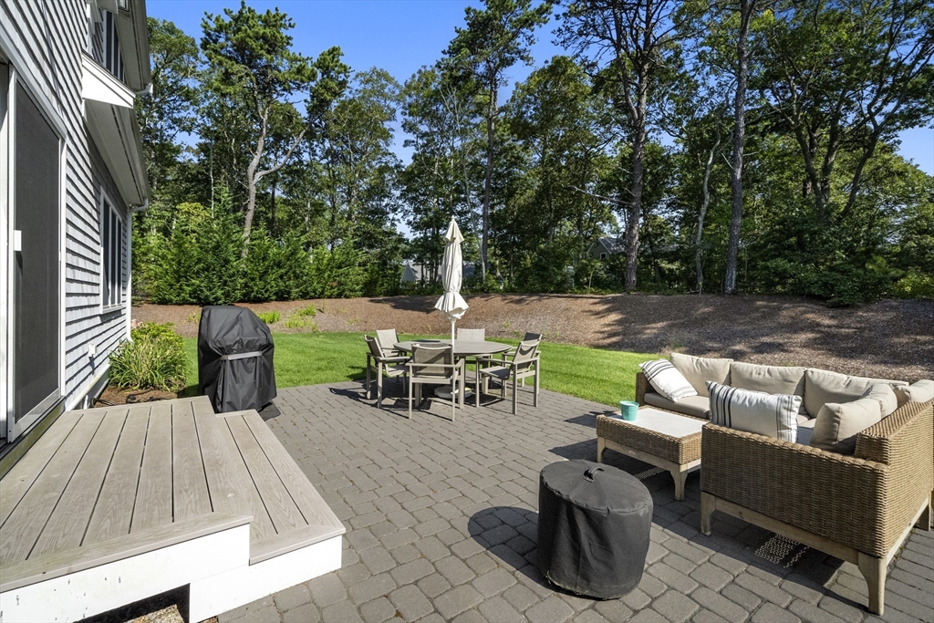 3 Bascom Hollow Harwich, MA 02645 - Photo 29 of 32 a view of backyard with seating space and trees