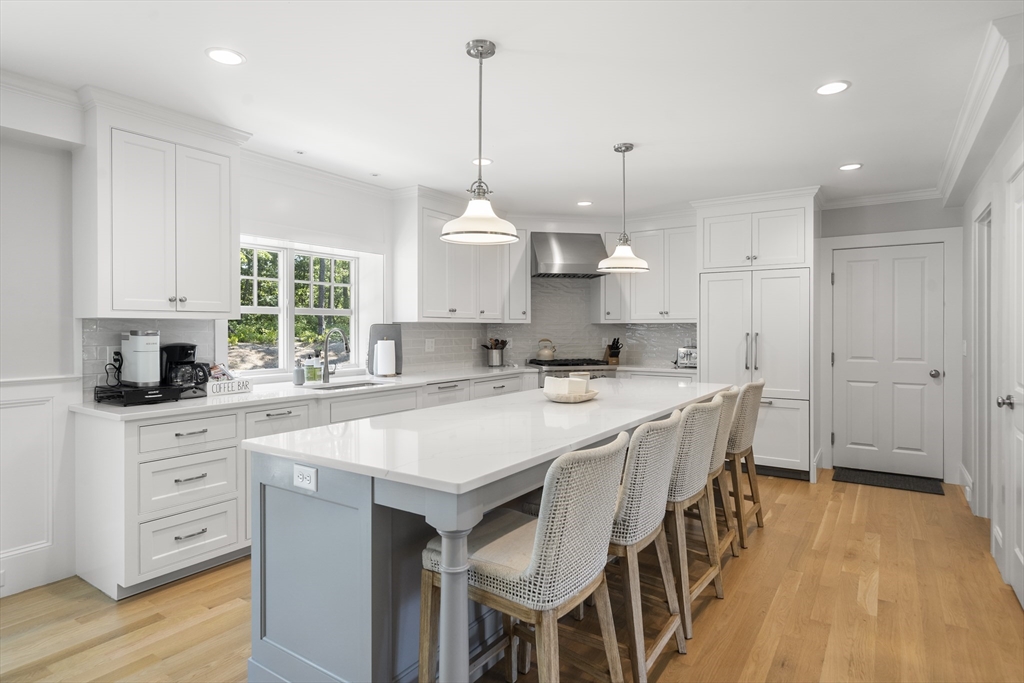 3 Bascom Hollow Harwich, MA 02645 - Photo 5 of 32 a open kitchen with stainless steel appliances granite countertop a stove a sink a center island and cabinets