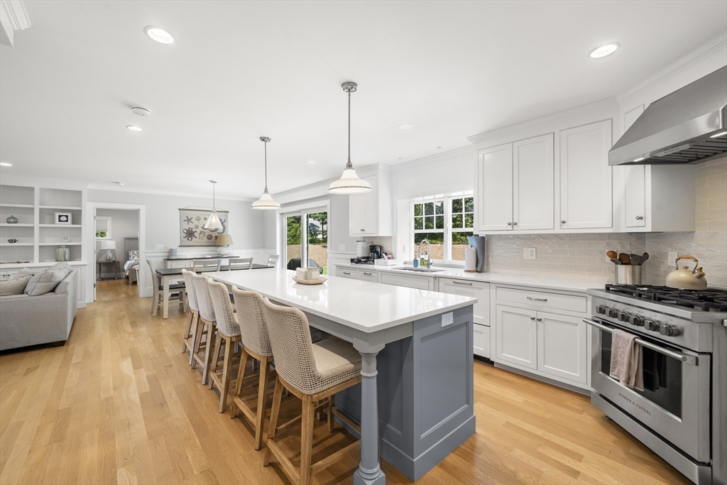 3 Bascom Hollow Harwich, MA 02645 - Photo 6 of 32 a kitchen with stainless steel appliances granite countertop a stove and a wooden floors