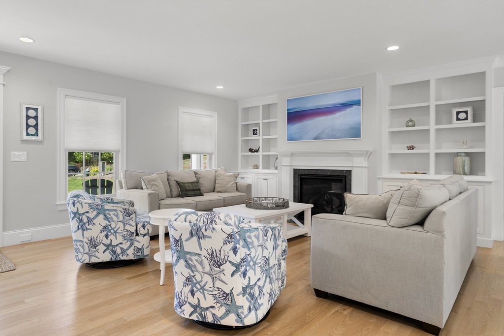 3 Bascom Hollow Harwich, MA 02645 - Photo 8 of 32 a living room with furniture and a fireplace