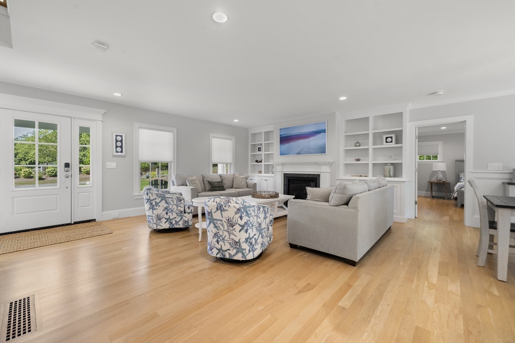 3 Bascom Hollow Harwich, MA 02645 - Photo 9 of 32 a living room with furniture and a fireplace