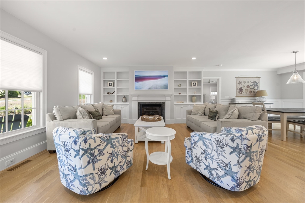 3 Bascom Hollow Harwich, MA 02645 - Photo 10 of 32 a living room with furniture large window and wooden floor