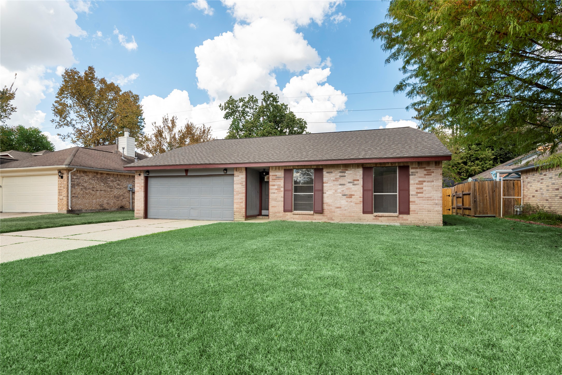 4919 Tealgate Drive Spring, TX 77373 - Photo 1 of 38 a front view of a house with garden