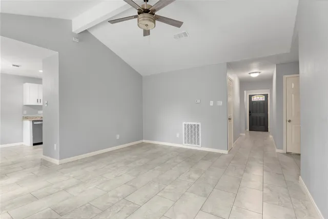 a kitchen with granite countertop a stove and a sink with granite countertops
