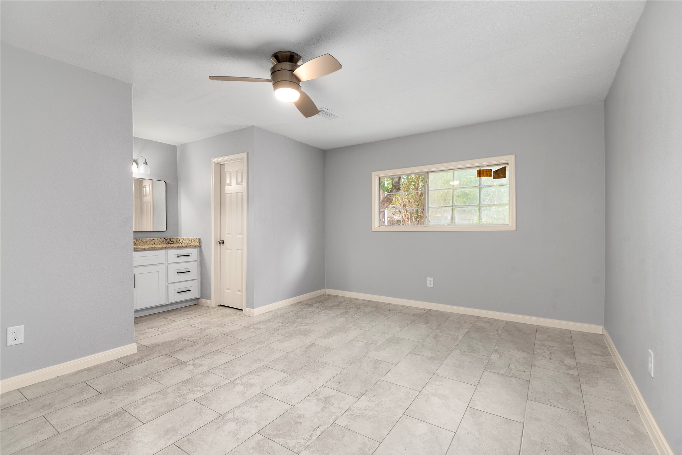 4919 Tealgate Drive Spring, TX 77373 - Photo 21 of 38 wooden floor in an empty room with a window